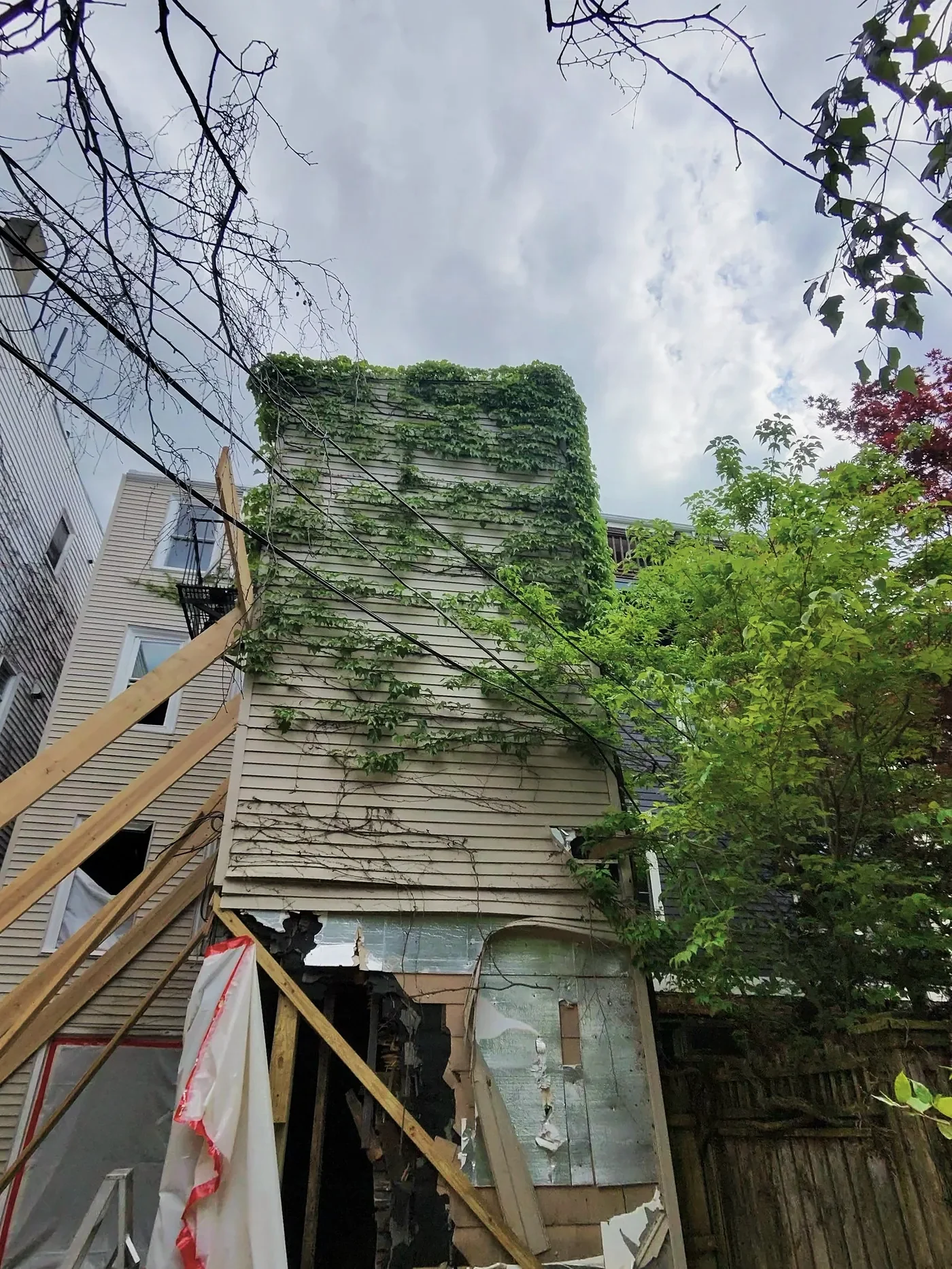 Rear of a building during renovation with temporary bracing